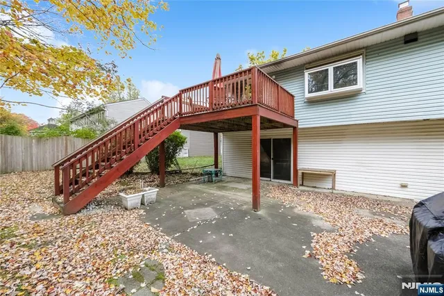 a view of a house with wooden deck