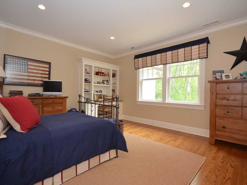 253 Middlesex Road Darien, CT 06820 - Photo 16 of 25 a bedroom with a bed and a window