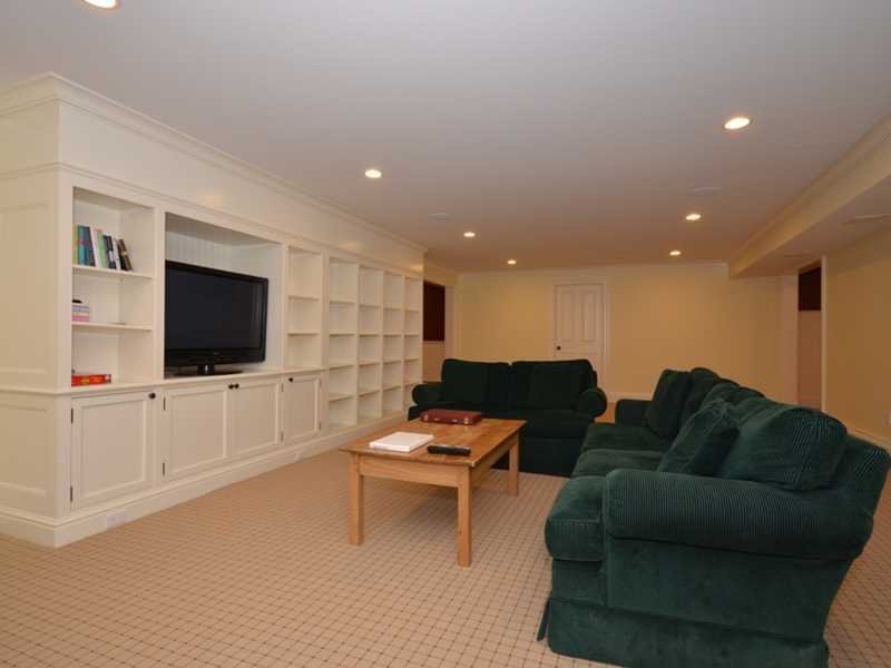 253 Middlesex Road Darien, CT 06820 - Photo 21 of 25 a living room with furniture and a flat screen tv