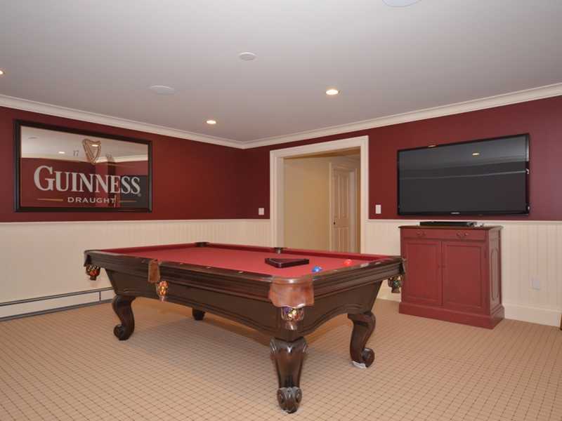 253 Middlesex Road Darien, CT 06820 - Photo 22 of 25 a room with furniture and flat screen tv