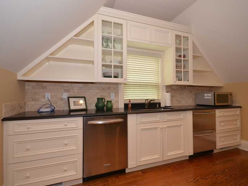 253 Middlesex Road Darien, CT 06820 - Photo 24 of 25 a kitchen with granite countertop white cabinets and white appliances