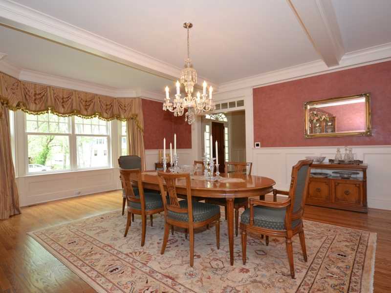 253 Middlesex Road Darien, CT 06820 - Photo 6 of 25 a view of a dining room with furniture a chandelier and wooden floor