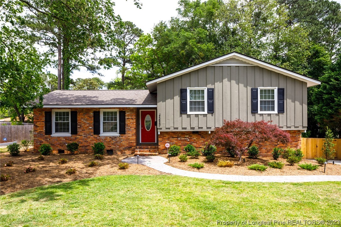 2620 Huntington Road Fayetteville, NC 28303 - Photo 1 of 23 a front view of house with yard outdoor seating and barbeque oven
