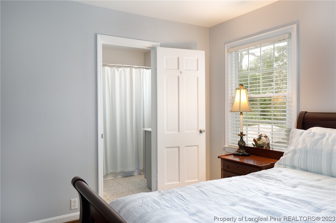 2620 Huntington Road Fayetteville, NC 28303 - Photo 14 of 23 a bedroom with a bed and a window