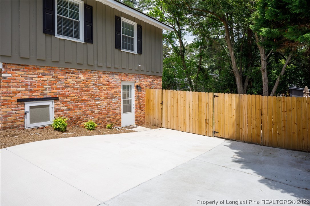 2620 Huntington Road Fayetteville, NC 28303 - Photo 17 of 23 a front view of a house with a yard