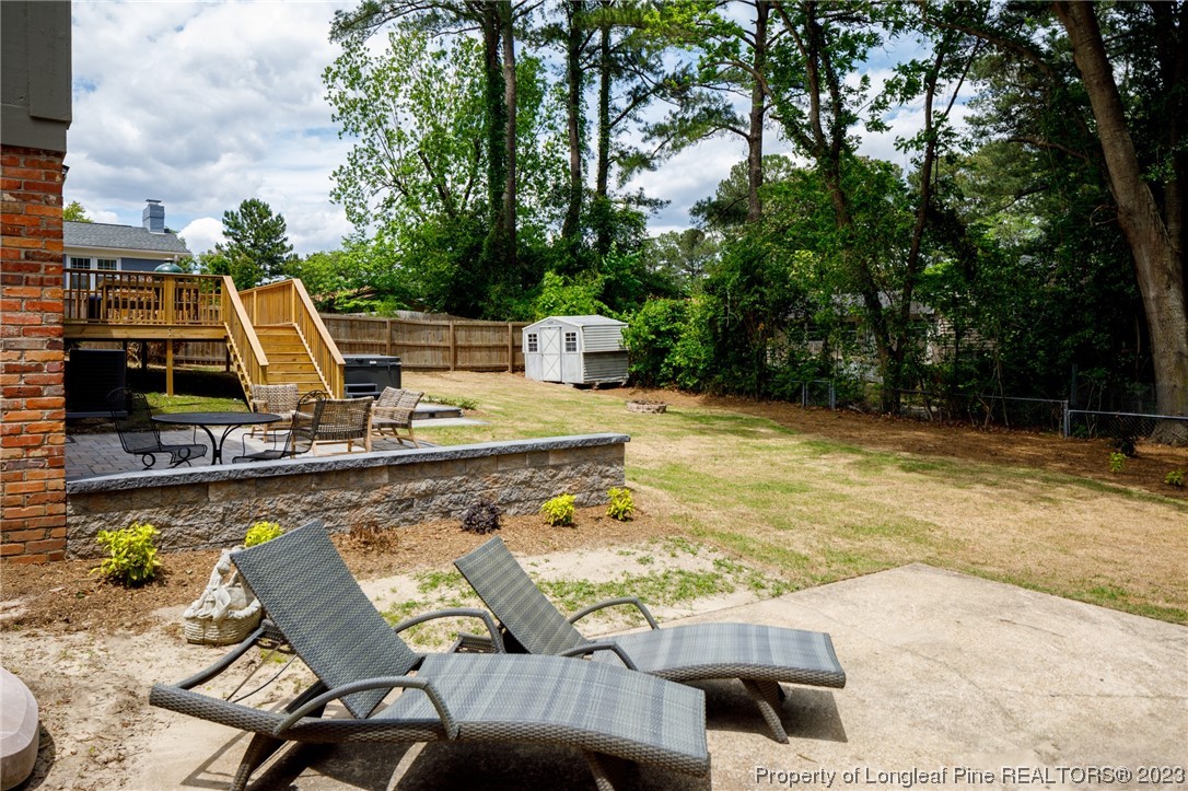 2620 Huntington Road Fayetteville, NC 28303 - Photo 18 of 23 a view of a swimming pool with lounge chairs