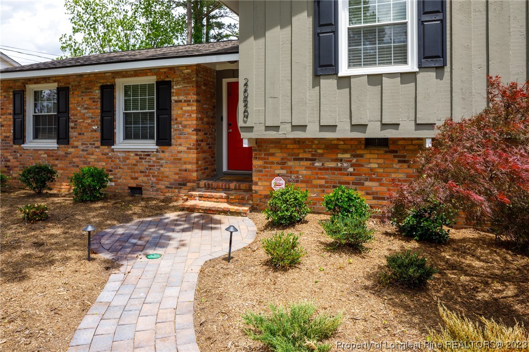 2620 Huntington Road Fayetteville, NC 28303 - Photo 3 of 23 a front view of a house with garden