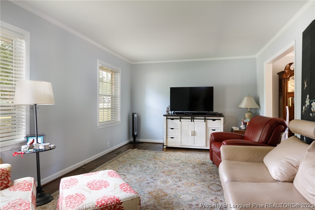 2620 Huntington Road Fayetteville, NC 28303 - Photo 4 of 23 a living room with furniture and a flat screen tv