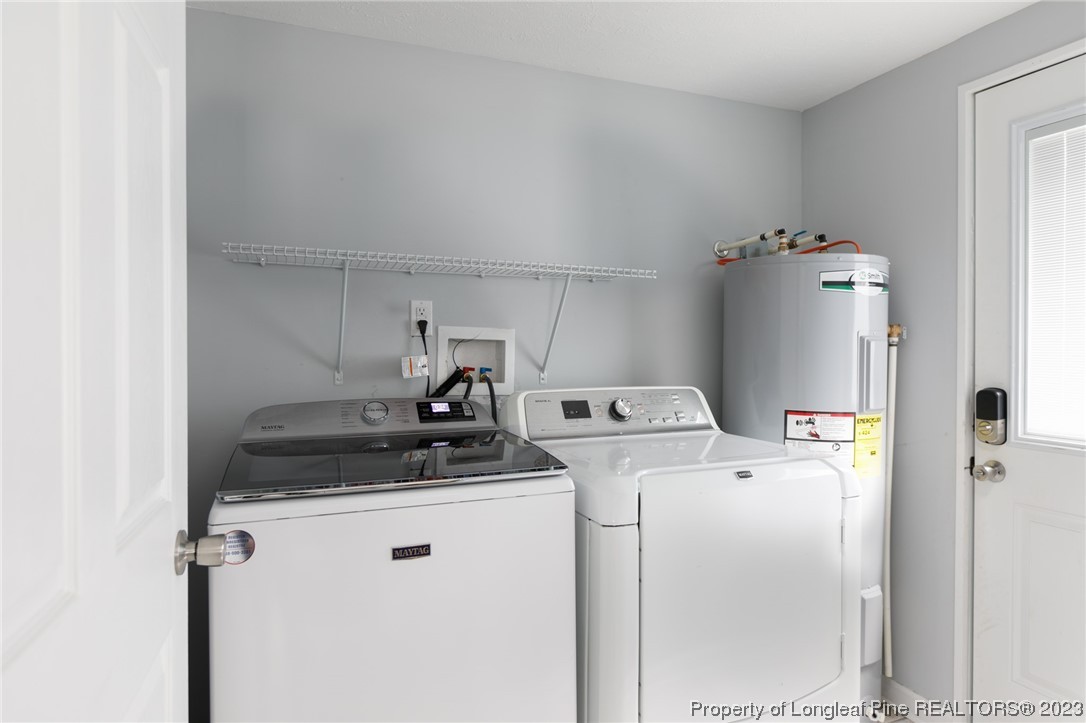 2620 Huntington Road Fayetteville, NC 28303 - Photo 8 of 23 a utility room with dryer and washer