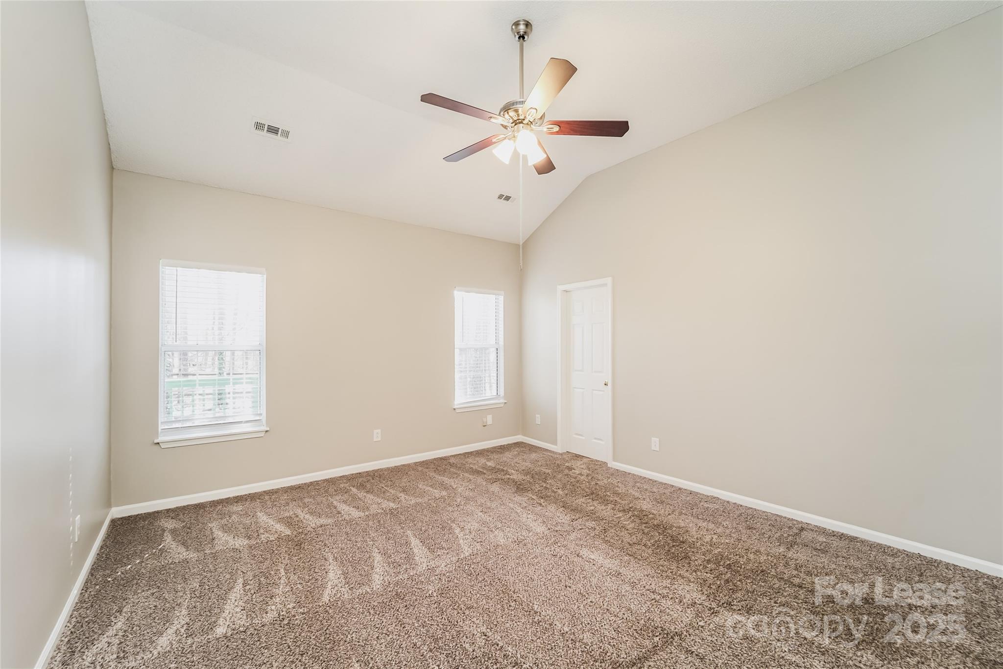 7121 Scuppernong Court Charlotte, NC 28215 - Photo 12 of 15 a view of an empty room with a window
