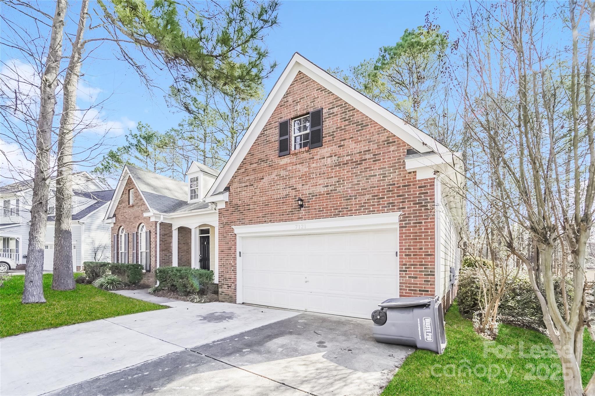 7121 Scuppernong Court Charlotte, NC 28215 - Photo 2 of 15 a view of house with a yard and front view of a house