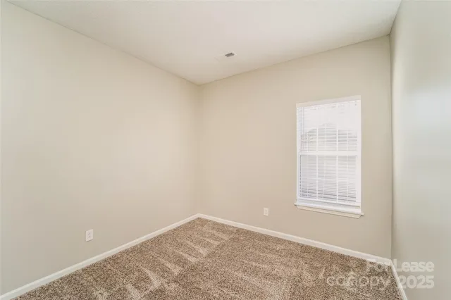 a view of a room that has a window in it