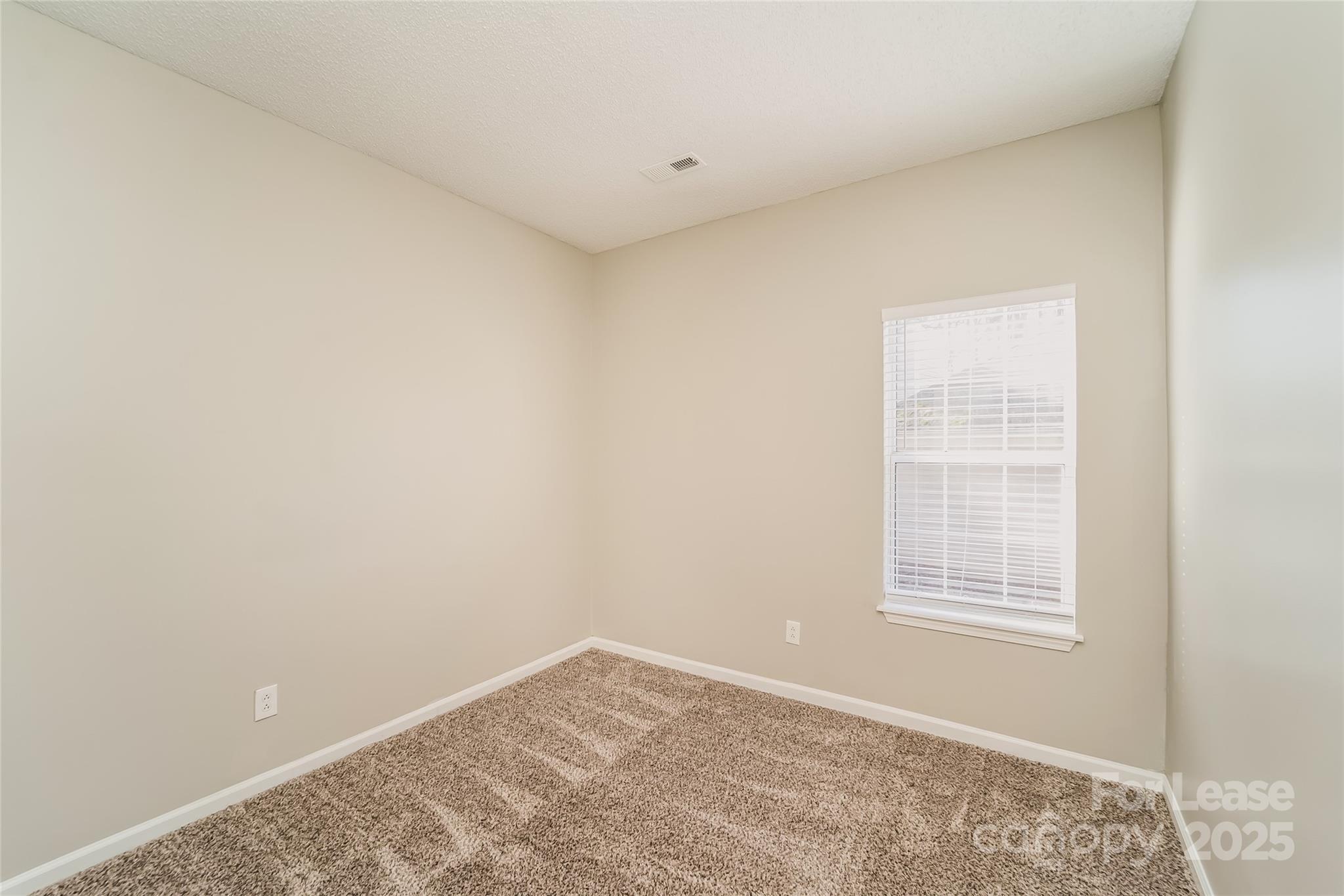 7121 Scuppernong Court Charlotte, NC 28215 - Photo 8 of 15 a view of a room that has a window in it