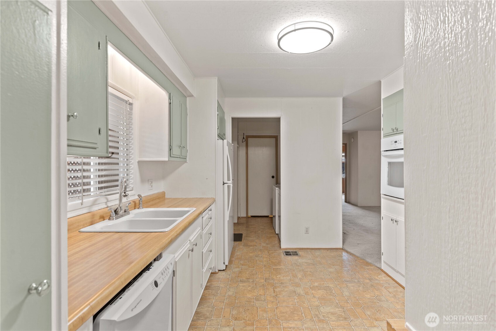1311 Maple Street, Unit 18 Wenatchee, WA 98801 - Photo 12 of 28 a bathroom with a granite countertop sink mirror and double