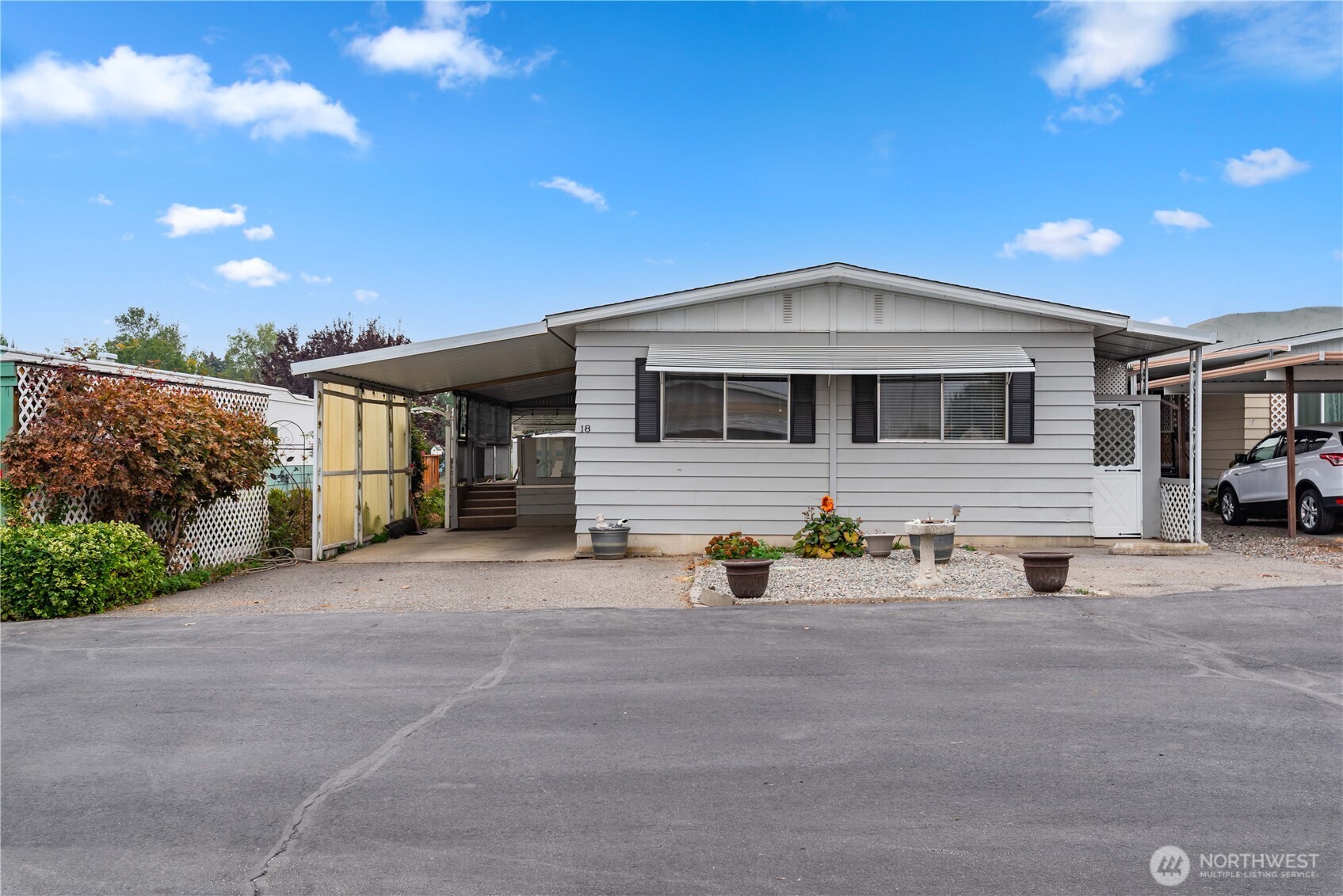 1311 Maple Street, Unit 18 Wenatchee, WA 98801 - Photo 28 of 28 a front view of a house with patio