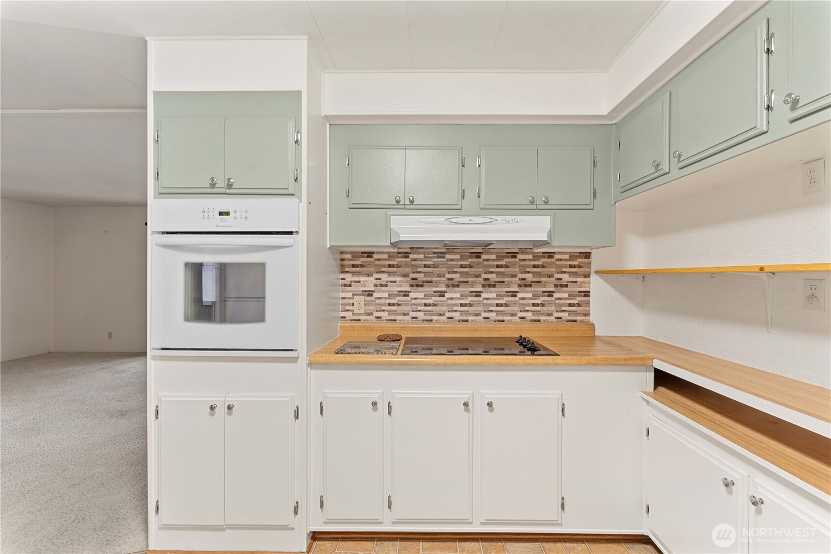 1311 Maple Street, Unit 18 Wenatchee, WA 98801 - Photo 10 of 28 a view of kitchen with cabinets