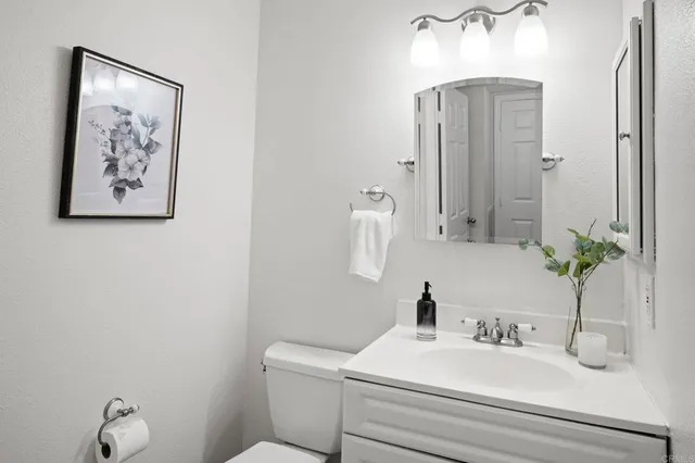a view of a house with pool and chairs