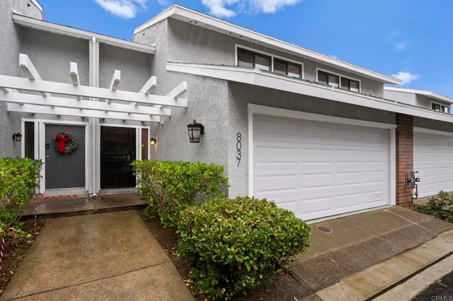 a living room with furniture large window and a fireplace