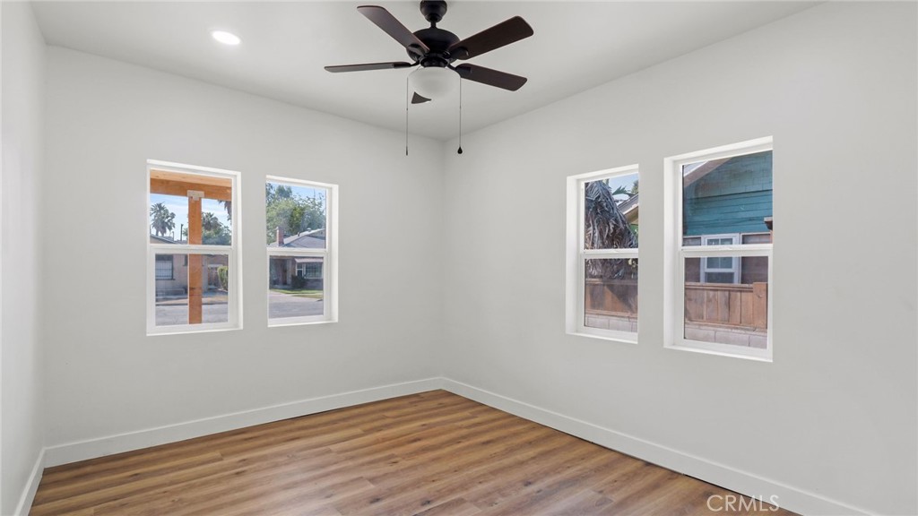 3309 Locust Street Riverside, CA 92501 - Photo 12 of 14 a view of an empty room with a window and wooden floor