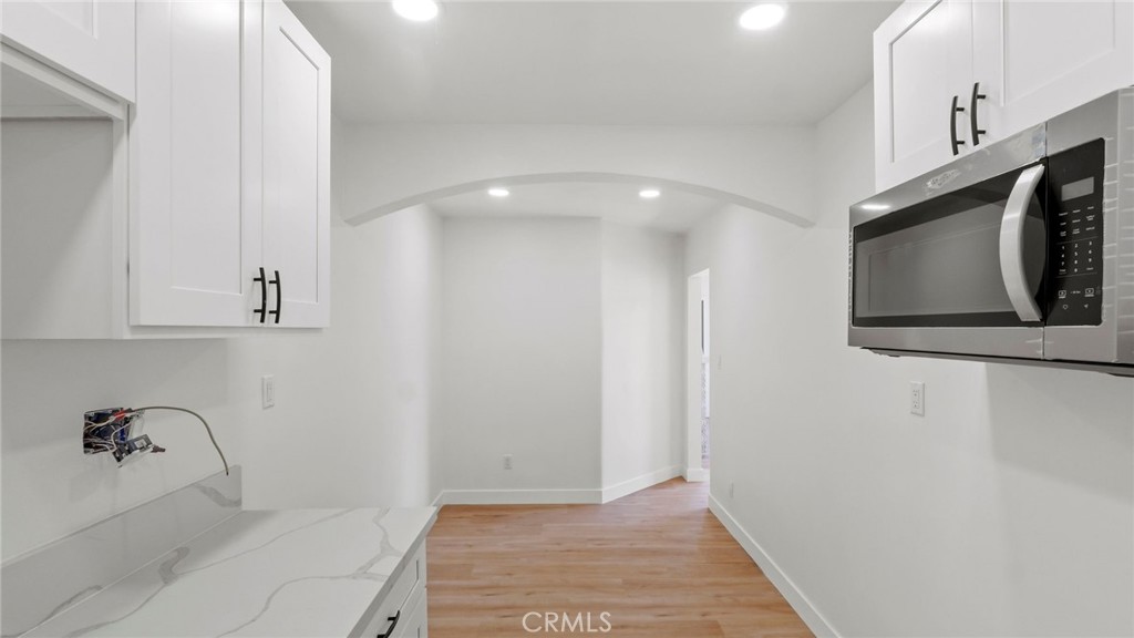 3309 Locust Street Riverside, CA 92501 - Photo 14 of 14 a bathroom with a bathtub and a shower