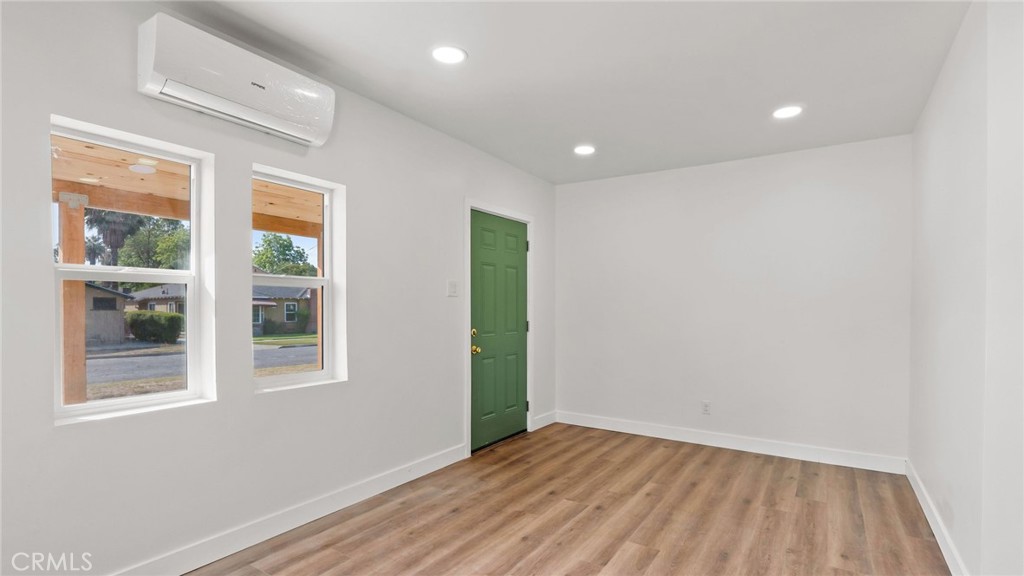 3309 Locust Street Riverside, CA 92501 - Photo 4 of 14 a view of an empty room with wooden floor and a window