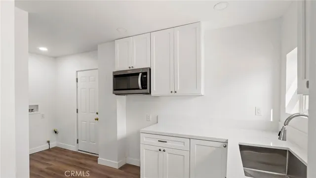 a view of a kitchen from the hallway