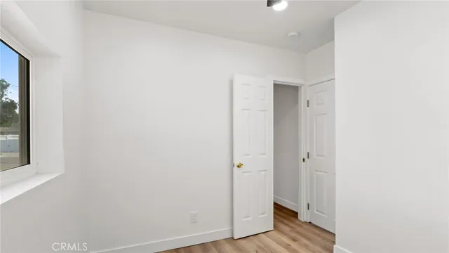 a view of a bathroom with wooden floor