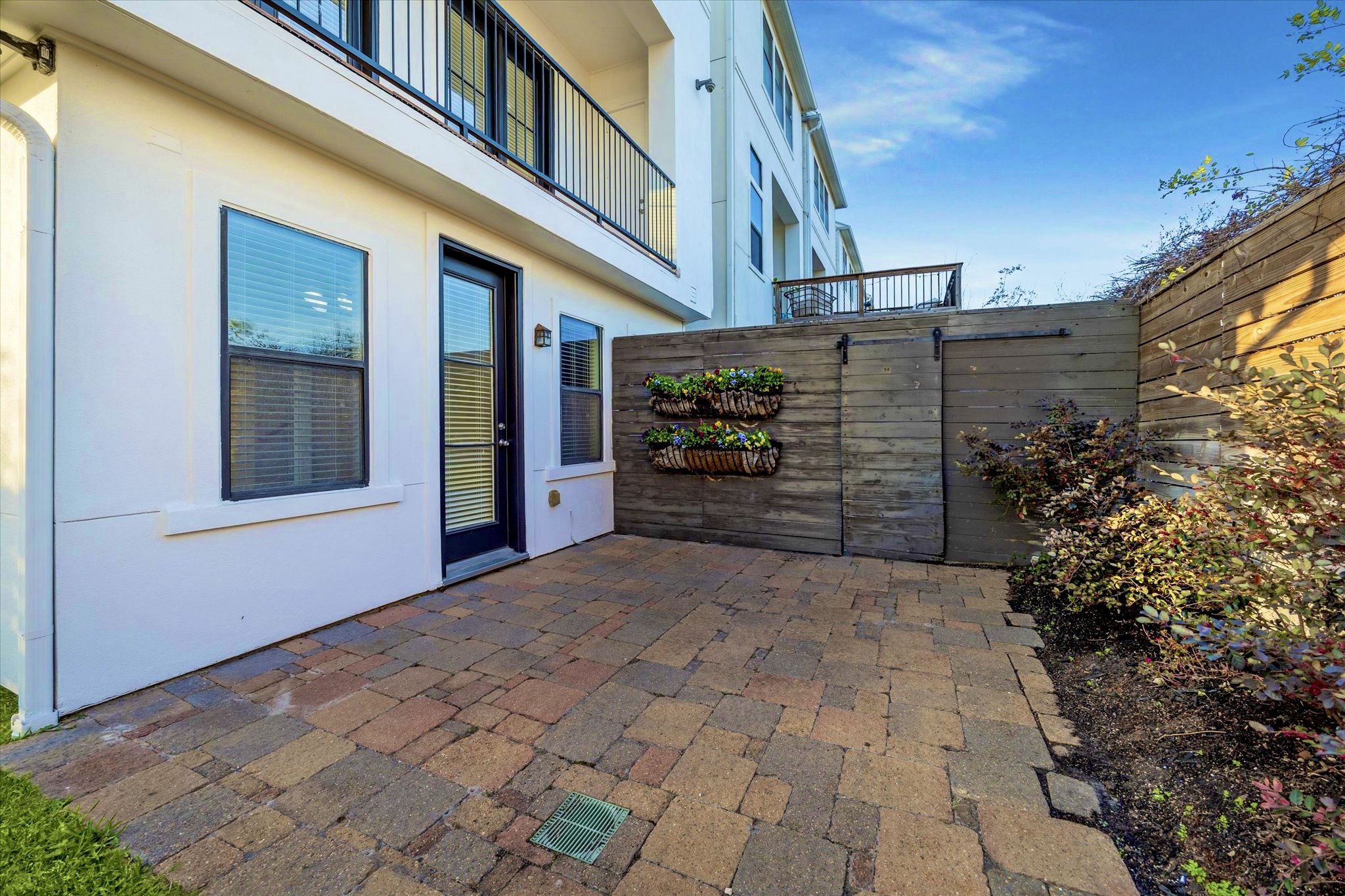 1819 Dart Street Houston, TX 77007 - Photo 7 of 30 Stone patio surrounded by lush foliage