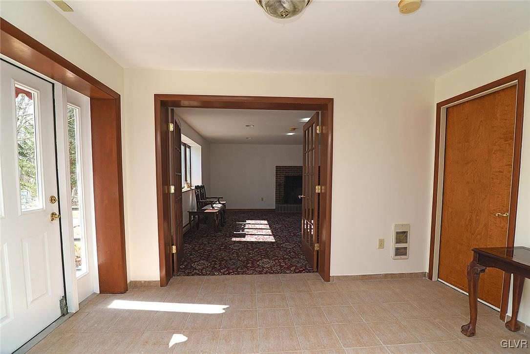 789 Dotters Corner Road Kunkletown, PA 18058 - Photo 25 of 49 a view of a hallway with wooden floor and a livingroom view