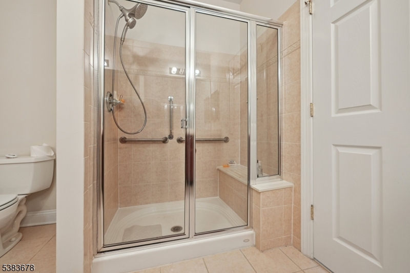 252 Victoria Drive, Unit 252 Bridgewater, NJ 08807 - Photo 14 of 26 a bathroom with a glass shower door