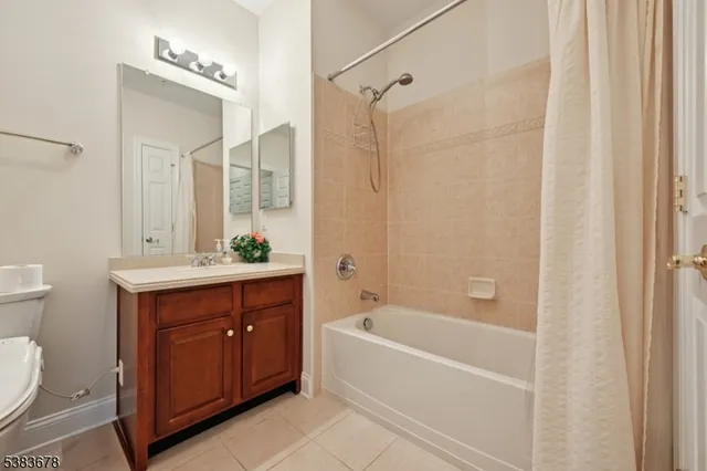 a bathroom with a bathtub a sink a toilet and a mirror