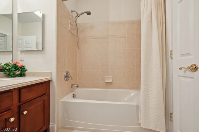 a bathroom with a bathtub and shower