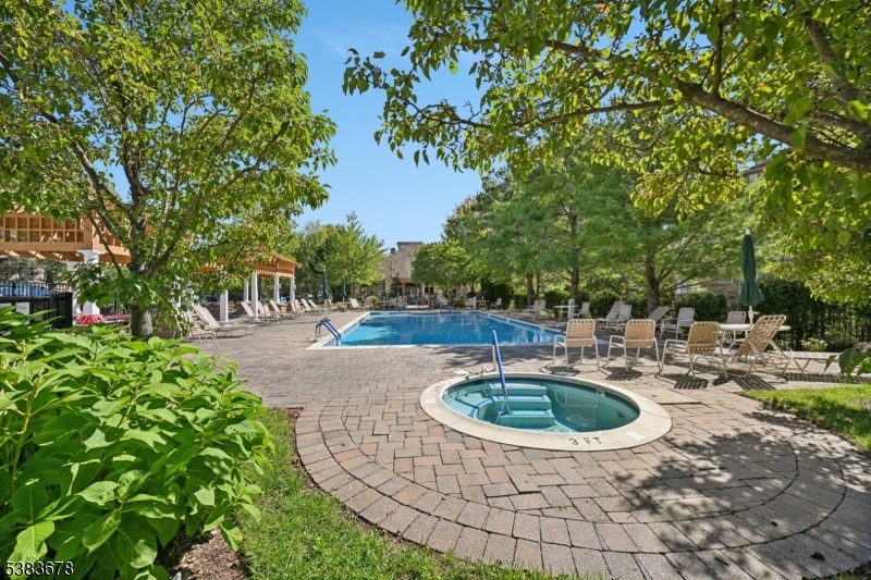 252 Victoria Drive, Unit 252 Bridgewater, NJ 08807 - Photo 22 of 26 a view of a swimming pool with a yard