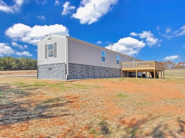 a front view of a house with a swimming pool