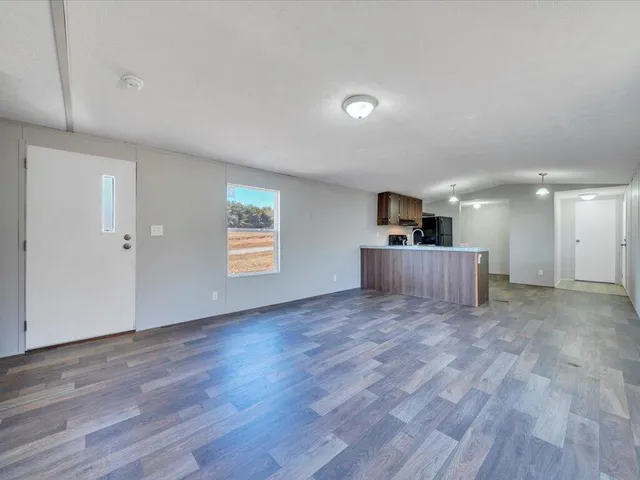 a view of kitchen and wooden floor