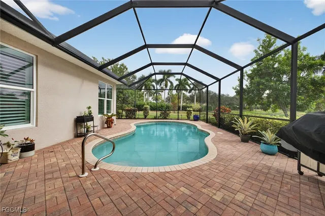 a view of a swimming pool with a patio