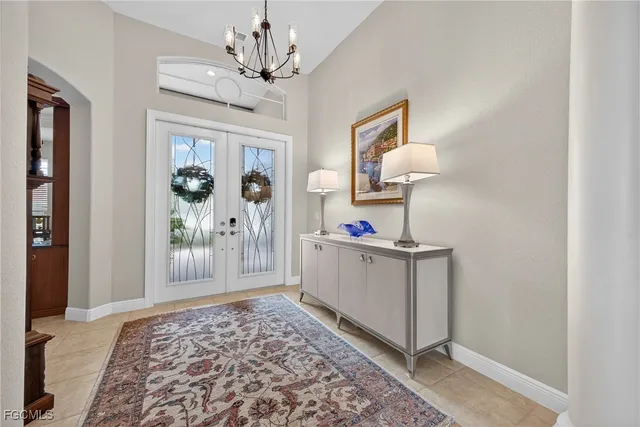 a living room with a couch and a chandelier