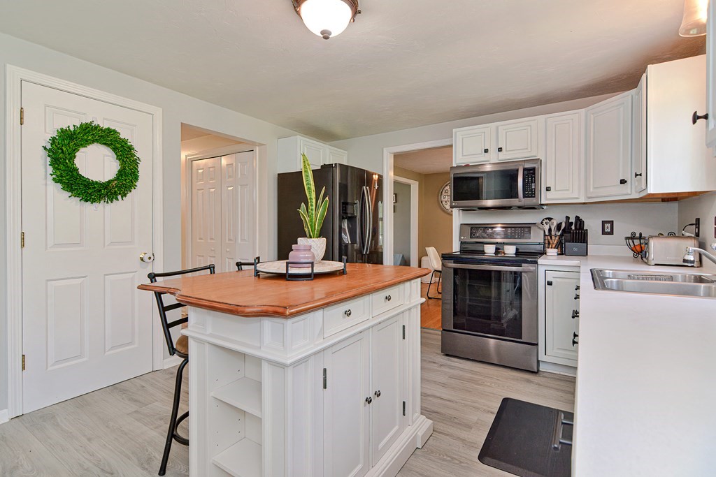 20 Prouty Lane Rutland, MA 01543 - Photo 14 of 40 a kitchen with stainless steel appliances kitchen island wooden cabinets and granite counter tops