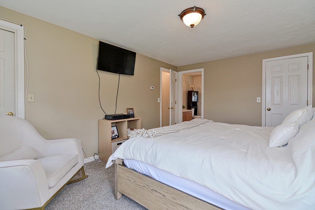 20 Prouty Lane Rutland, MA 01543 - Photo 19 of 40 a bedroom with a bed and a flat screen tv