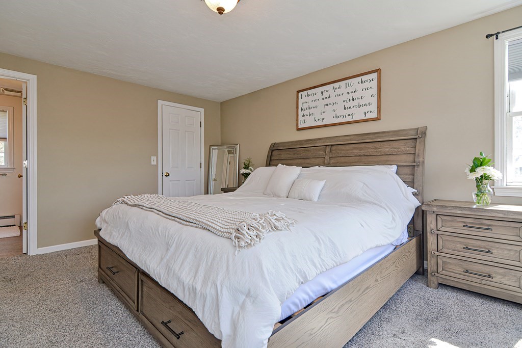 20 Prouty Lane Rutland, MA 01543 - Photo 20 of 40 a bedroom with bed and paintings on the wall