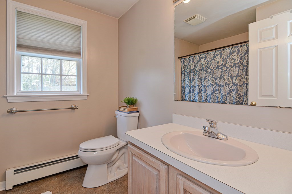 20 Prouty Lane Rutland, MA 01543 - Photo 23 of 40 a bathroom with a sink a toilet and a window