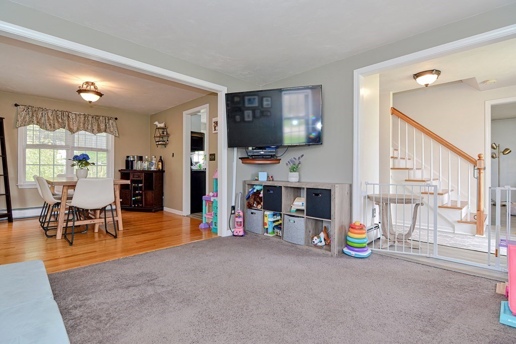 20 Prouty Lane Rutland, MA 01543 - Photo 6 of 40 a living room with furniture a flat screen tv and a fireplace
