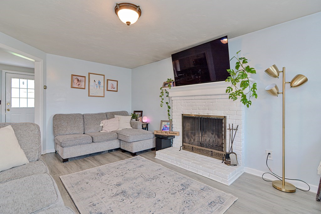 20 Prouty Lane Rutland, MA 01543 - Photo 10 of 40 a living room with furniture a fireplace and a flat screen tv