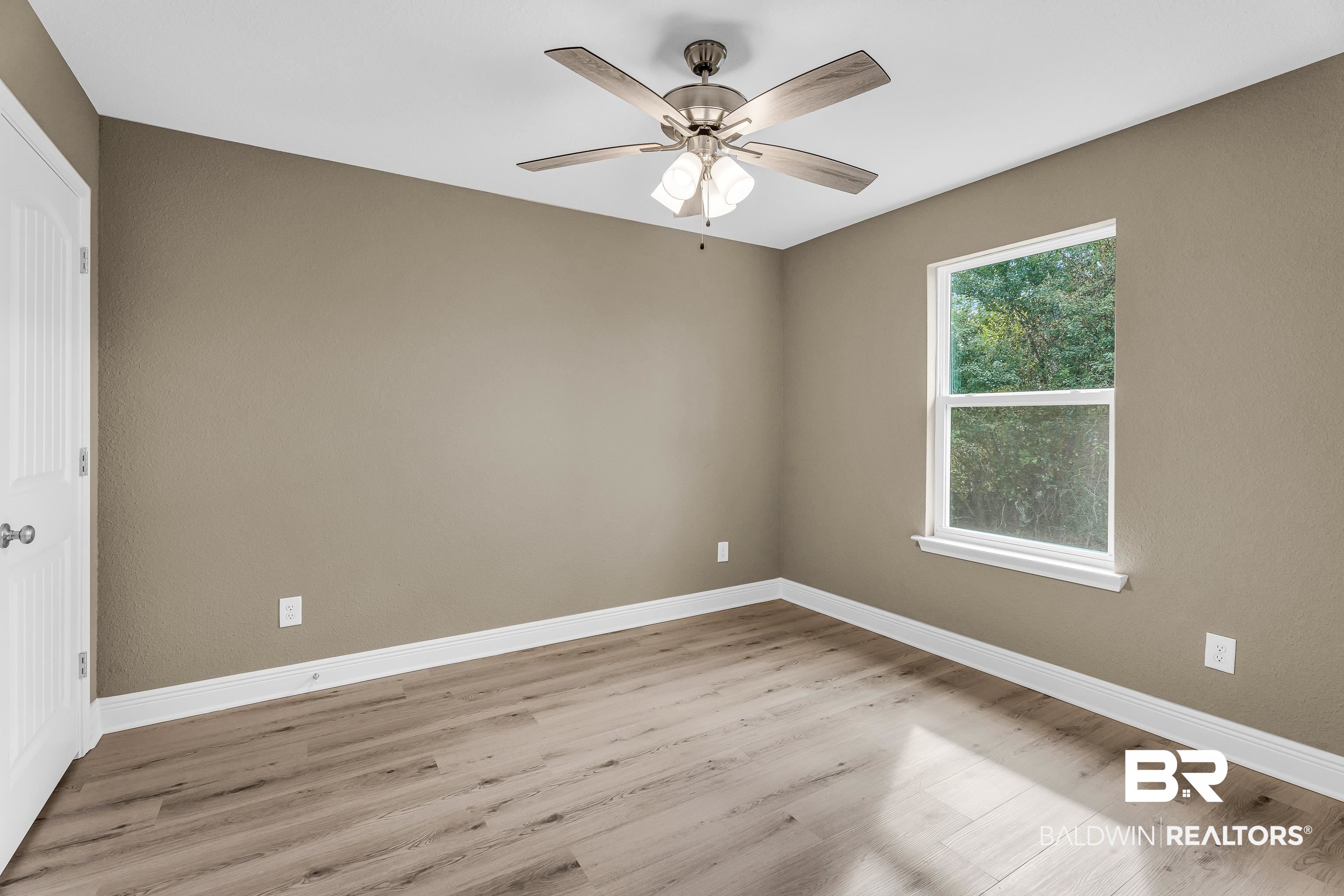 9206 Greenleaf Drive Daphne, AL 36527 - Photo 18 of 32 Unfurnished room with light wood finished floors and ceiling fan