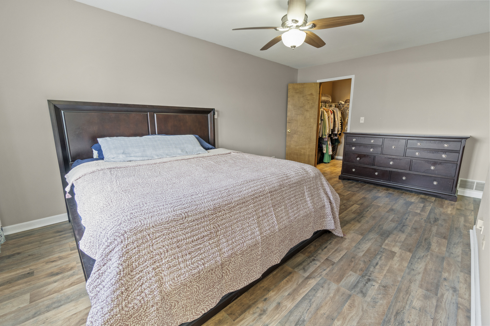 946 Pin Oak Circle Cary, IL 60013 - Photo 13 of 35 a bedroom with a bed and wooden floor
