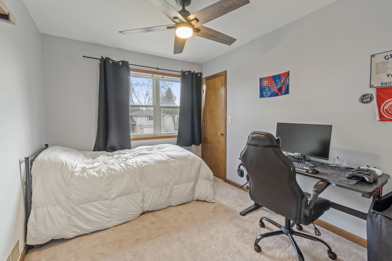 946 Pin Oak Circle Cary, IL 60013 - Photo 16 of 35 a bedroom with a bed and a desk