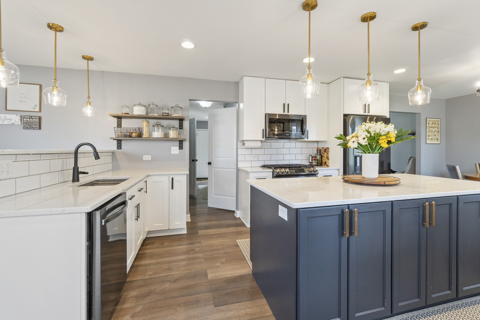 946 Pin Oak Circle Cary, IL 60013 - Photo 2 of 35 a kitchen that has a lot of cabinets and stainless steel appliances