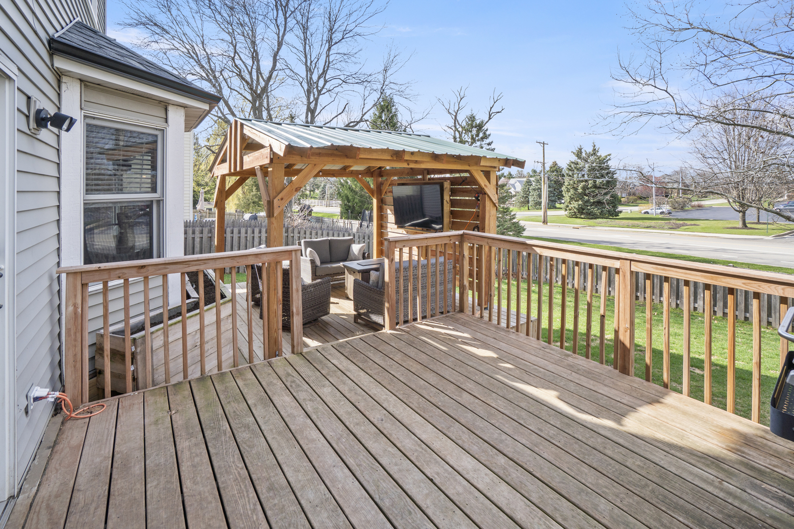 946 Pin Oak Circle Cary, IL 60013 - Photo 23 of 35 a view of a wooden deck with a yard
