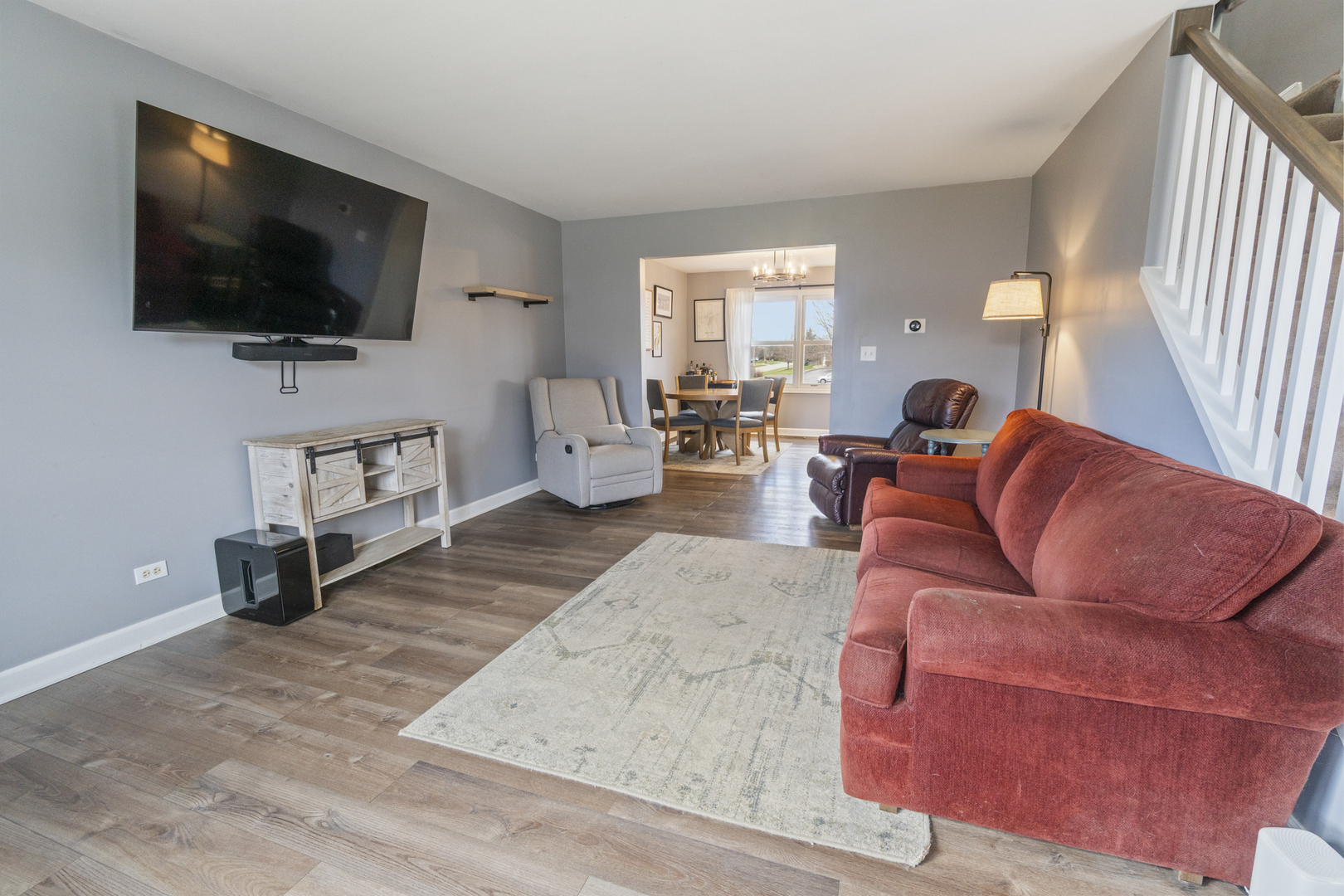 946 Pin Oak Circle Cary, IL 60013 - Photo 7 of 35 a living room with furniture and a flat screen tv