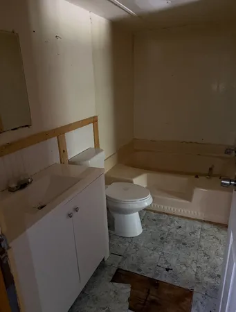a bathroom with a toilet and a sink